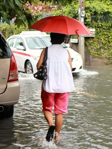 Bangkok_Flooding_Umbrella_Woman Rainy season floods... a regular occurrence while I was living in Bangkok!